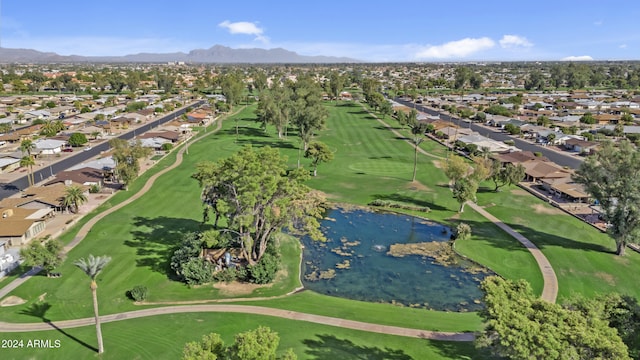 birds eye view of property with a water and mountain view