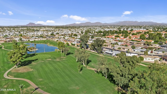 drone / aerial view featuring a water and mountain view