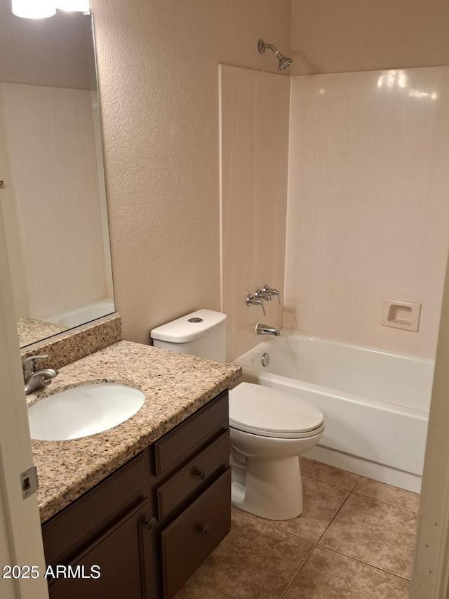 bathroom with tile patterned flooring, shower / bathing tub combination, vanity, and toilet