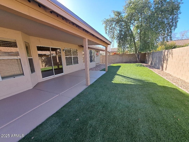 view of yard with a fenced backyard and a patio