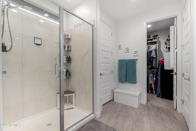 bathroom featuring a shower with shower door