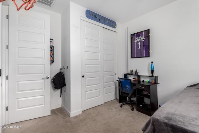 carpeted bedroom featuring a closet