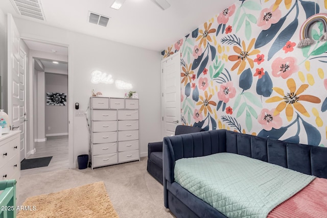 bedroom featuring light colored carpet