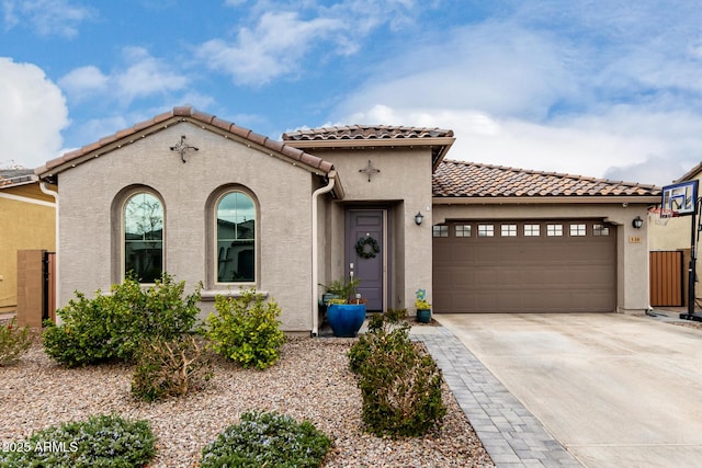 mediterranean / spanish house featuring a garage