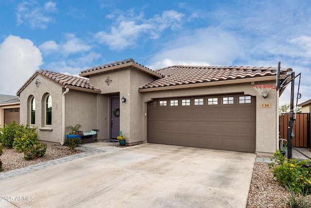 mediterranean / spanish house with a garage