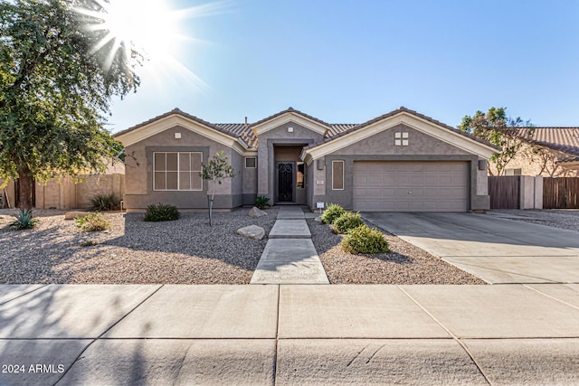 ranch-style home featuring a garage