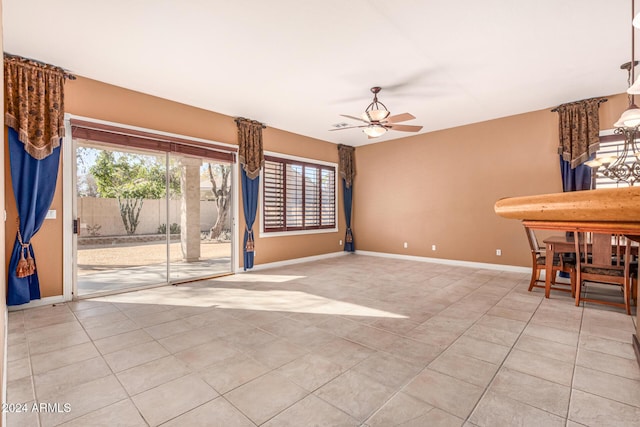 interior space featuring light tile patterned floors and ceiling fan