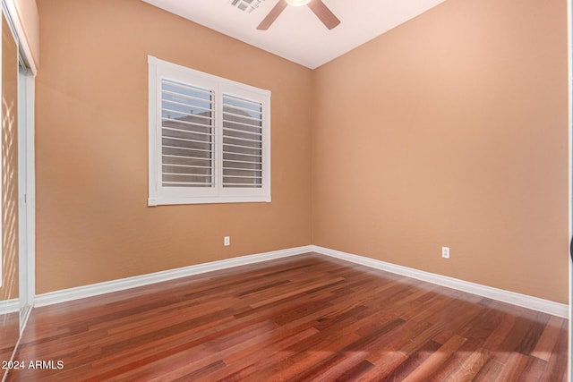 empty room featuring hardwood / wood-style flooring and ceiling fan