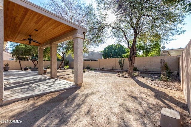 view of yard with a patio and ceiling fan