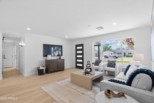 8732 E Arlington Rd, Scottsdale, AZ 85250 - living area featuring light wood-type flooring, baseboards, and recessed lighting