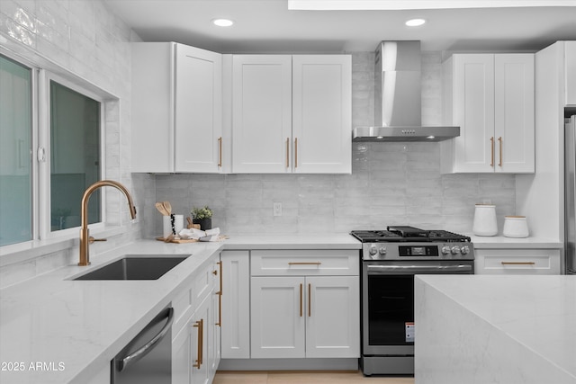 8732 E Arlington Rd, Scottsdale, AZ 85250 - kitchen featuring wall chimney exhaust hood, stainless steel appliances, a sink, white cabinetry, and light stone countertops