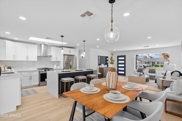 8732 E Arlington Rd, Scottsdale, AZ 85250 - dining space featuring recessed lighting and light wood finished floors