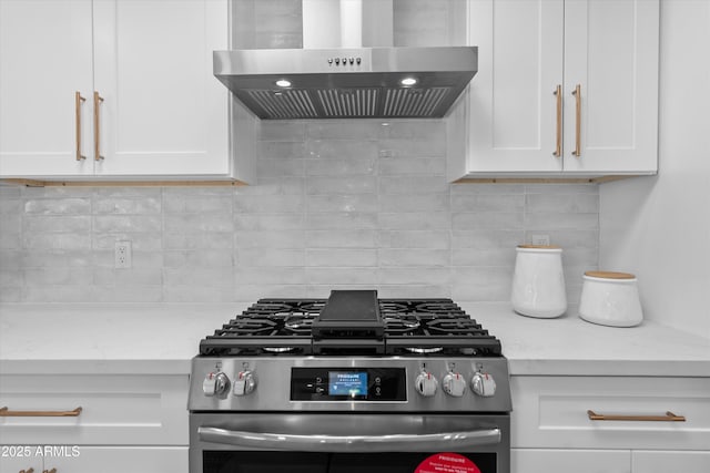 8732 E Arlington Rd, Scottsdale, AZ 85250 - kitchen with ventilation hood, gas range, white cabinetry, and backsplash