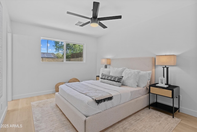 8732 E Arlington Rd, Scottsdale, AZ 85250 - bedroom featuring baseboards, wood finished floors, and ceiling fan