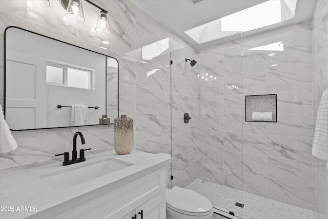 8732 E Arlington Rd, Scottsdale, AZ 85250 - full bath with a skylight, vanity, a stall shower, and toilet