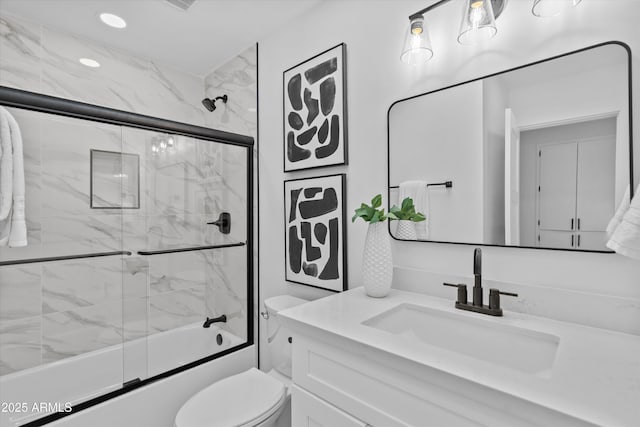 8732 E Arlington Rd, Scottsdale, AZ 85250 - full bath with vanity, shower / bath combination with glass door, toilet, and recessed lighting
