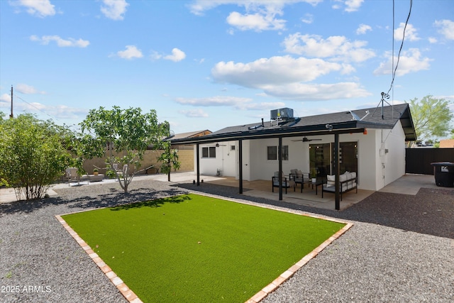 8732 E Arlington Rd, Scottsdale, AZ 85250 - back of property with a ceiling fan, a patio area, an outdoor living space, stucco siding, and roof with shingles