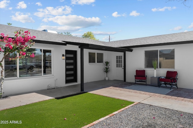 8732 E Arlington Rd, Scottsdale, AZ 85250 - back of property with roof with shingles, stucco siding, and a patio