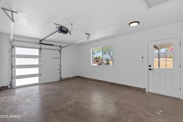 8732 E Arlington Rd, Scottsdale, AZ 85250 - garage with a garage door opener and baseboards