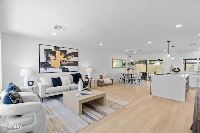 8732 E Arlington Rd, Scottsdale, AZ 85250 - living room with recessed lighting and light wood-style floors