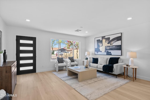 8732 E Arlington Rd, Scottsdale, AZ 85250 - living room with light wood-type flooring, baseboards, and recessed lighting
