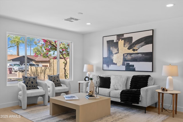 8732 E Arlington Rd, Scottsdale, AZ 85250 - living area featuring baseboards, wood finished floors, and recessed lighting