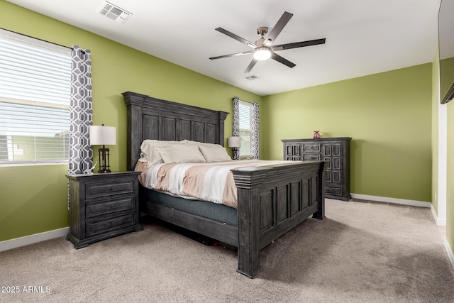 23407 W Winslow Ave, Buckeye, AZ 85326 - bedroom with light carpet, baseboards, and a ceiling fan