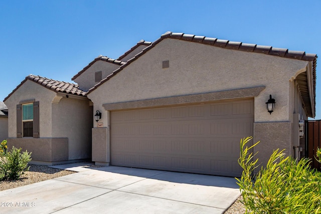 23407 W Winslow Ave, Buckeye, AZ 85326 - mediterranean / spanish home with stucco siding, a tiled roof, driveway, and an attached garage