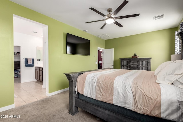 23407 W Winslow Ave, Buckeye, AZ 85326 - tiled bedroom featuring carpet, baseboards, a ceiling fan, and ensuite bathroom