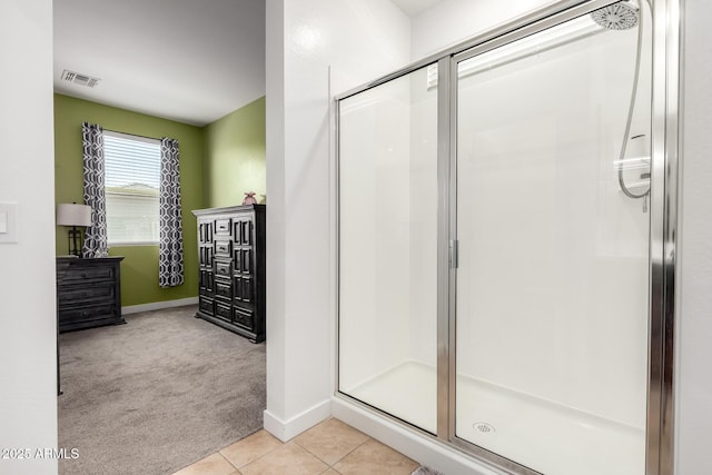 23407 W Winslow Ave, Buckeye, AZ 85326 - bathroom with a stall shower, baseboards, and tile patterned flooring