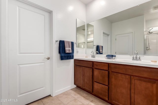 23407 W Winslow Ave, Buckeye, AZ 85326 - bathroom featuring double vanity, tile patterned floors, and a shower
