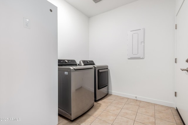 23407 W Winslow Ave, Buckeye, AZ 85326 - washroom with washing machine and dryer, light tile patterned floors, and baseboards