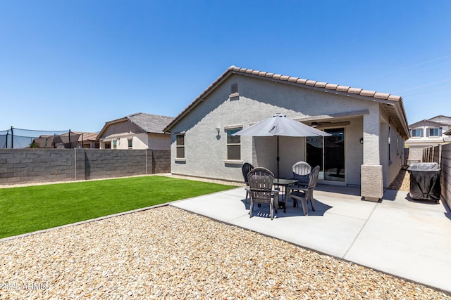 23407 W Winslow Ave, Buckeye, AZ 85326 - rear view of house with stucco siding, a patio, and a tile roof