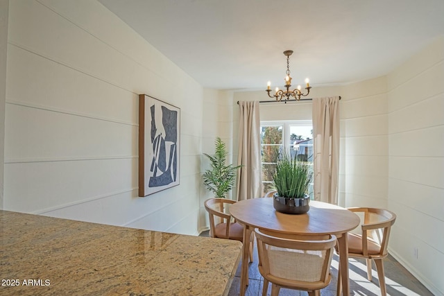 dining room featuring a notable chandelier