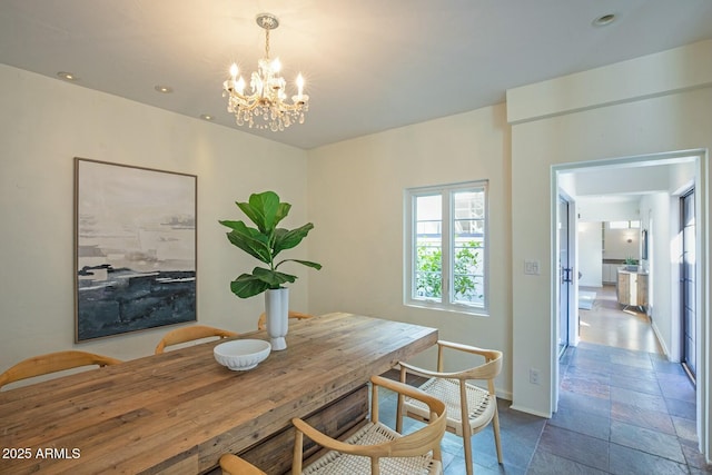 dining area featuring a chandelier