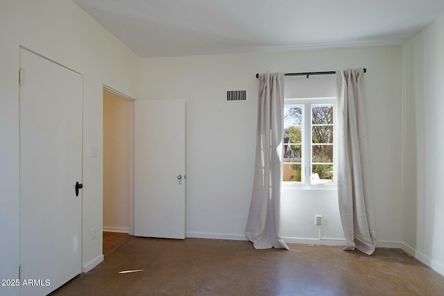 spare room with concrete flooring