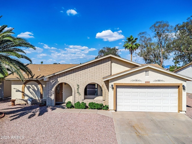 811 S 79th Way, Mesa, AZ 85208 - view of front of home featuring concrete driveway, a garage, and brick siding