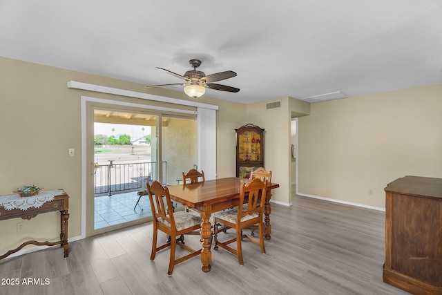 811 S 79th Way, Mesa, AZ 85208 - dining room with light wood finished floors, ceiling fan, and baseboards