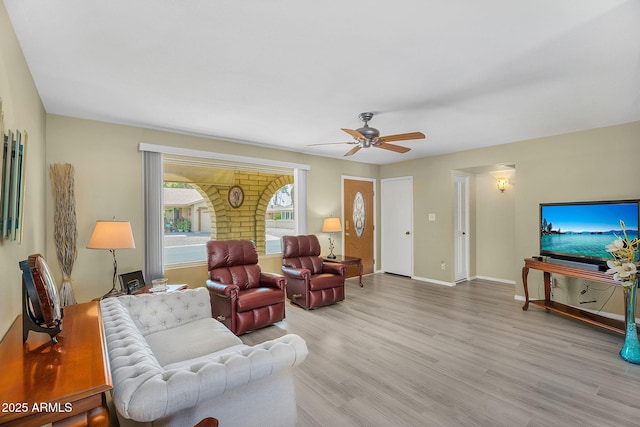 811 S 79th Way, Mesa, AZ 85208 - living area with a ceiling fan, light wood finished floors, and baseboards