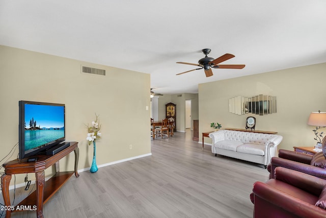 811 S 79th Way, Mesa, AZ 85208 - living area featuring a ceiling fan, wood finished floors, and baseboards