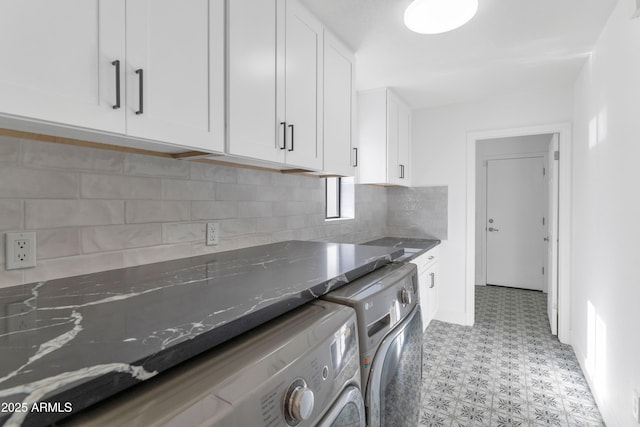 laundry area featuring cabinets and independent washer and dryer