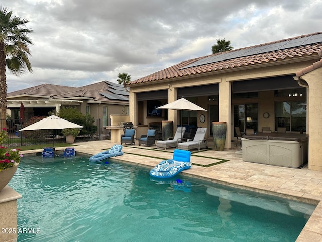 view of swimming pool with a patio area, fence, and a fenced in pool