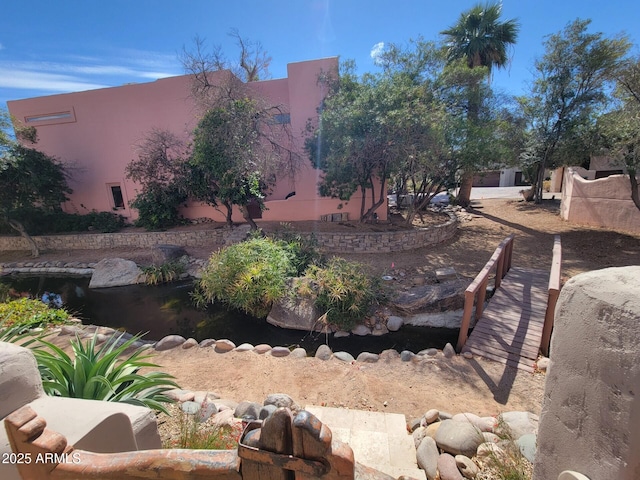 view of yard with a garden pond