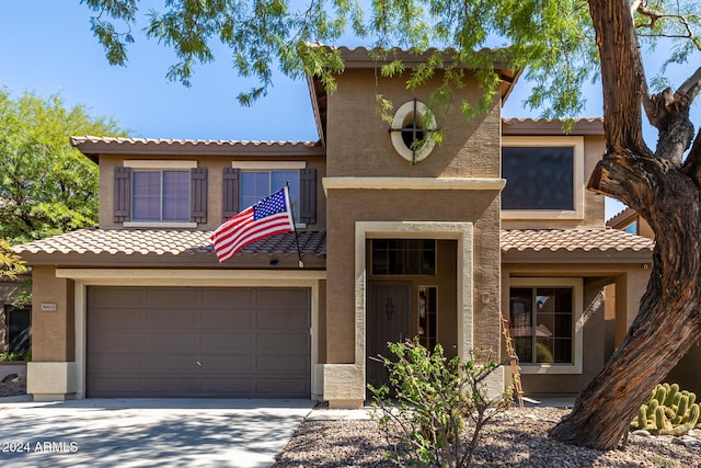 mediterranean / spanish-style home featuring a garage