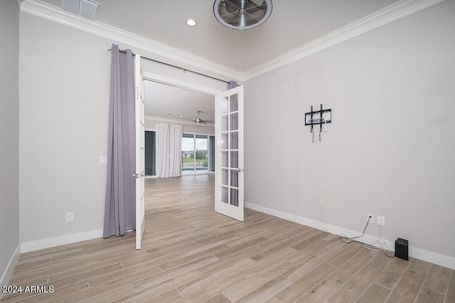 unfurnished room featuring light wood-type flooring, ceiling fan, french doors, and crown molding