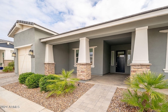 exterior space with a garage and a porch