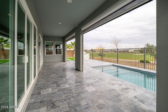 view of swimming pool with a patio area