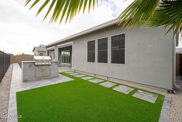 view of yard featuring area for grilling and a patio area