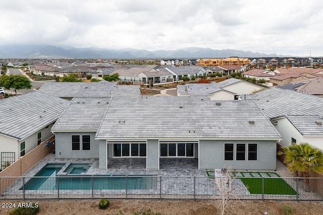 rear view of property with a mountain view