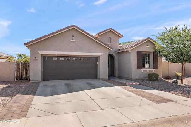 3326 N 31st St, Mesa, AZ 85213 - view of front of home with driveway, a garage, stucco siding, a tiled roof, and a gate